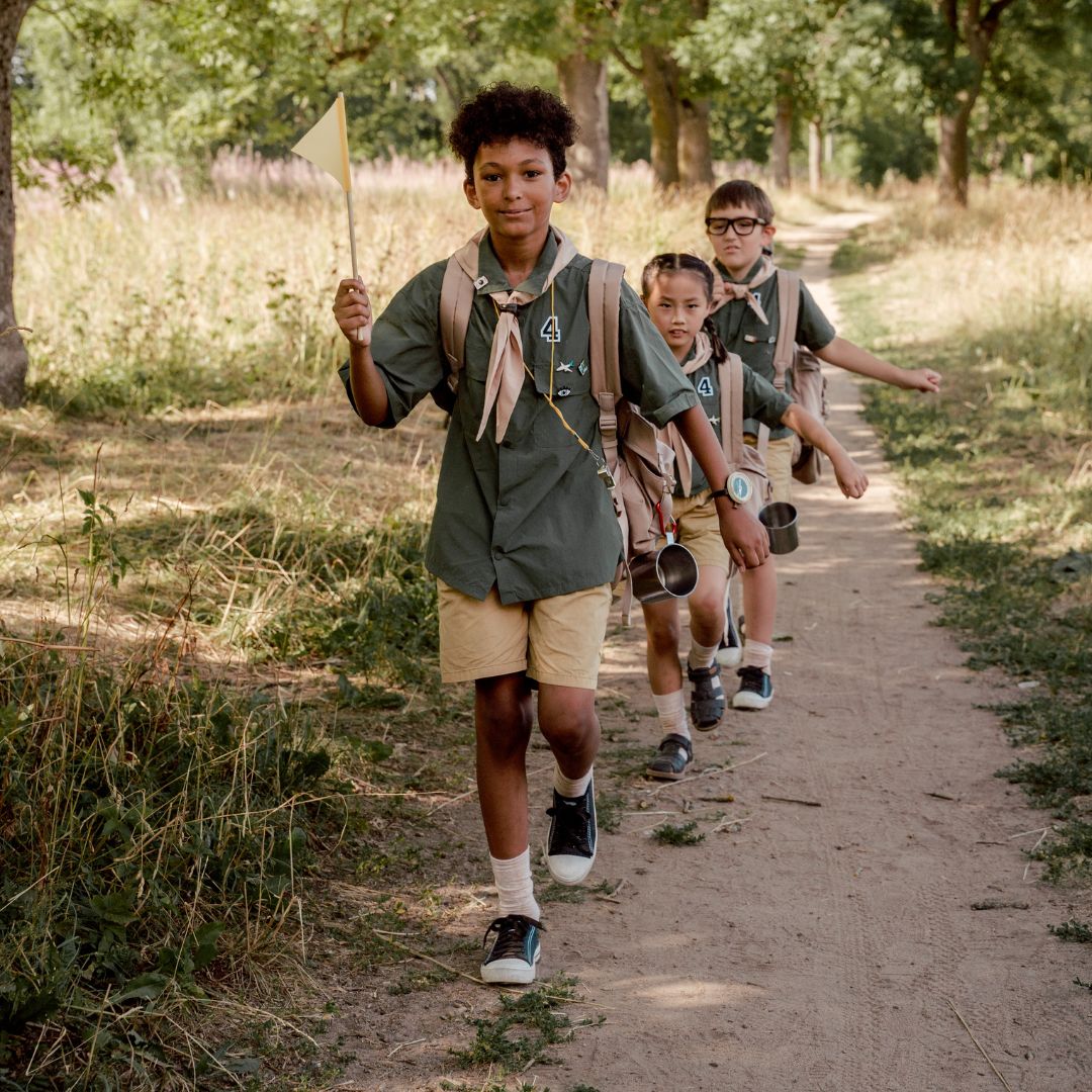 Boy scouts on a hike in the woods